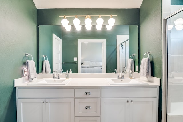 bathroom with walk in shower and vanity