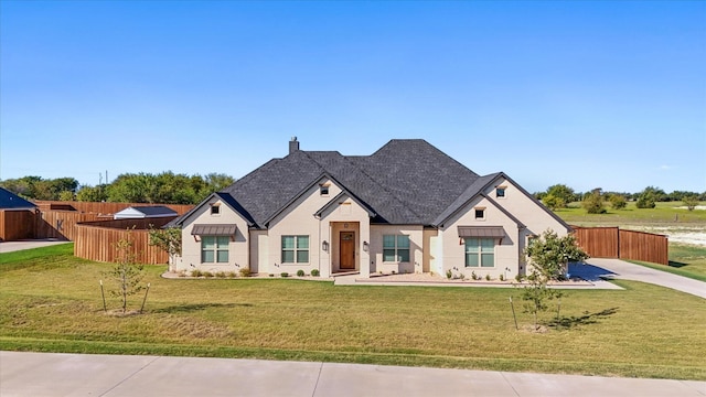 view of front of house featuring a front lawn