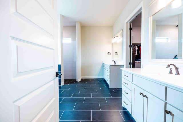 bathroom featuring tile patterned floors and vanity