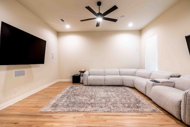 living room with hardwood / wood-style floors and ceiling fan