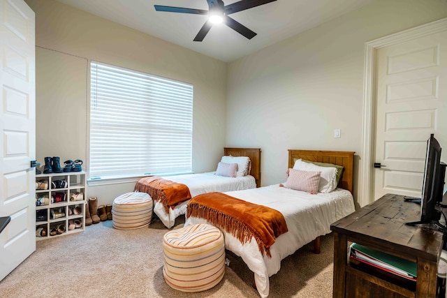 bedroom with light colored carpet and ceiling fan