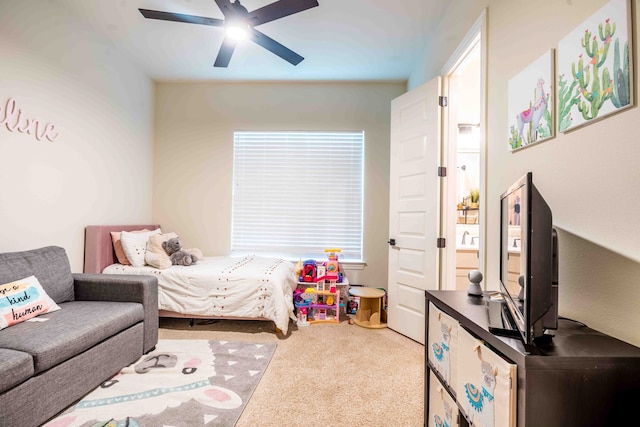 bedroom featuring light colored carpet and ceiling fan