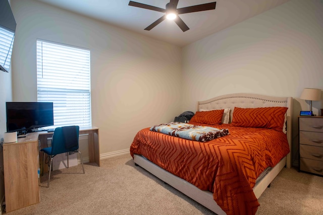 bedroom with light colored carpet and ceiling fan