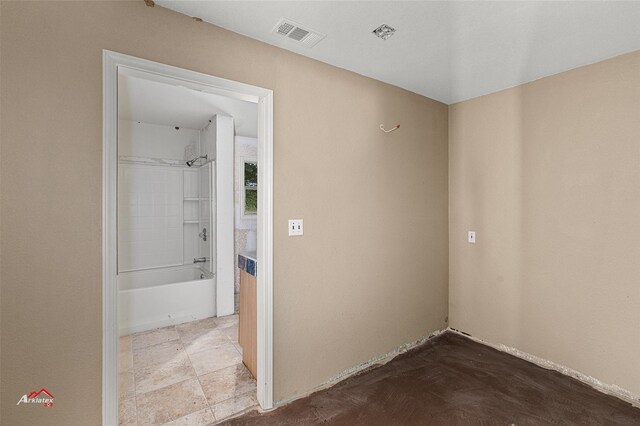 interior space with tiled shower / bath