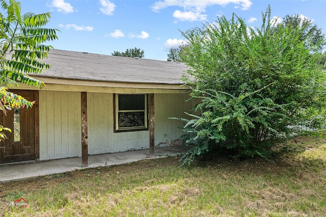 view of side of property with a patio area