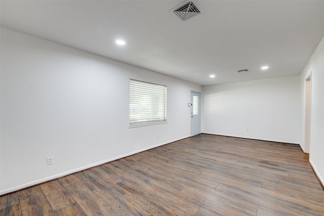 empty room featuring dark wood-type flooring