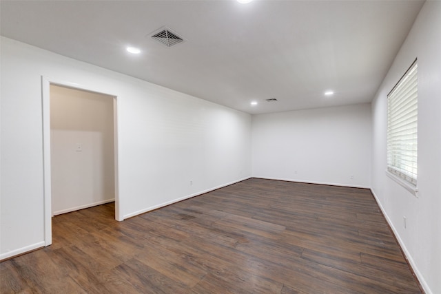 empty room with dark hardwood / wood-style floors