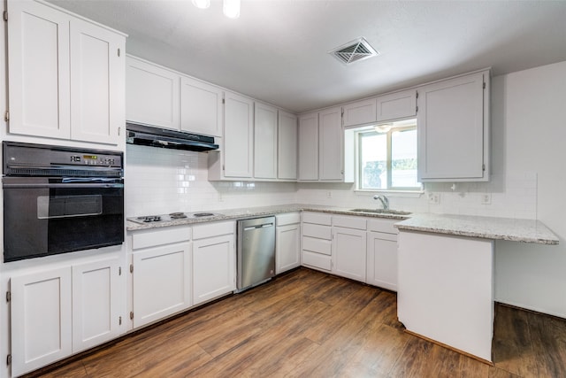 kitchen featuring white cabinets, black oven, dark hardwood / wood-style floors, and sink