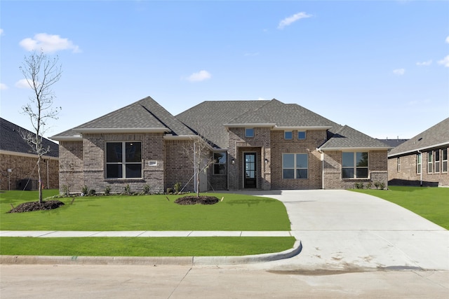 prairie-style house featuring a front lawn