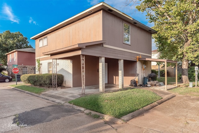 view of front of home with a carport