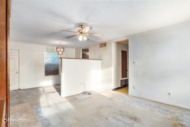 unfurnished room featuring ceiling fan with notable chandelier, ornamental molding, a textured ceiling, and light carpet