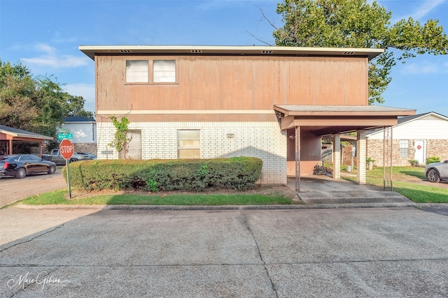 front facade with a carport