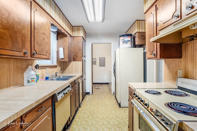 kitchen featuring white appliances and sink