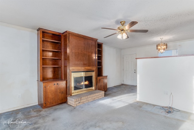 unfurnished living room with ceiling fan with notable chandelier, a textured ceiling, light colored carpet, and a fireplace