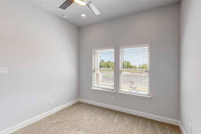 carpeted empty room with ceiling fan