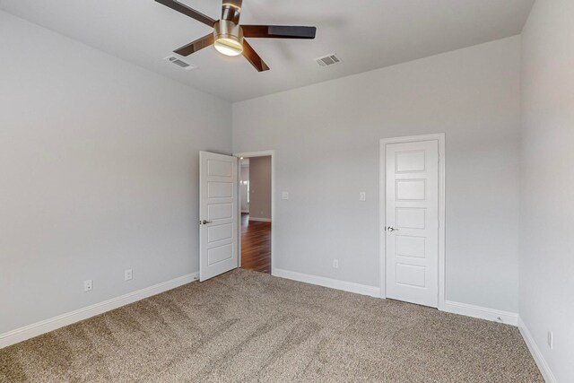 unfurnished bedroom featuring carpet and ceiling fan