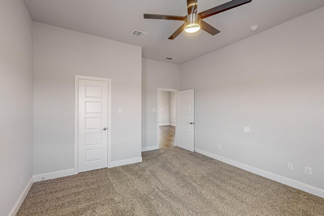 unfurnished bedroom with carpet floors and ceiling fan