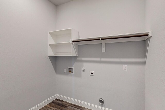 clothes washing area with gas dryer hookup, washer hookup, hookup for an electric dryer, and dark hardwood / wood-style floors