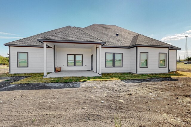 rear view of property with a patio area