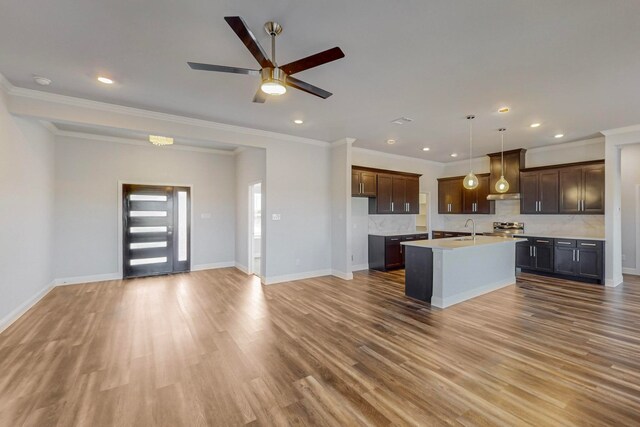 kitchen with hardwood / wood-style flooring, sink, a center island with sink, decorative light fixtures, and ceiling fan