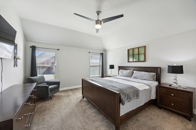 carpeted bedroom featuring ceiling fan and vaulted ceiling