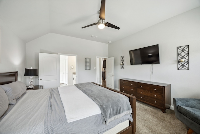 carpeted bedroom featuring lofted ceiling, ceiling fan, and connected bathroom