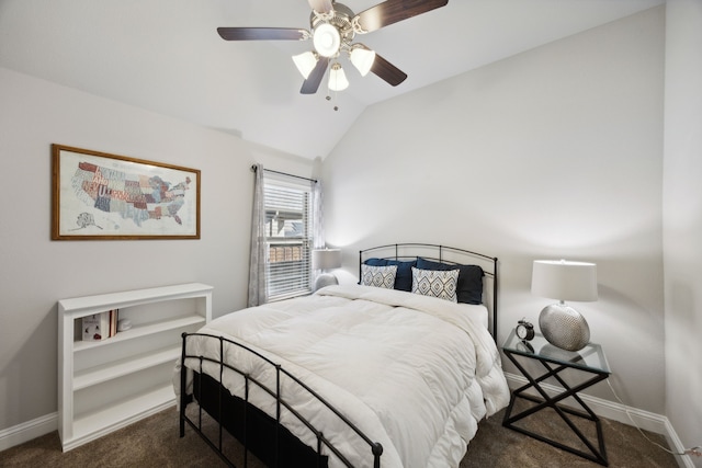 bedroom with ceiling fan, vaulted ceiling, and dark carpet