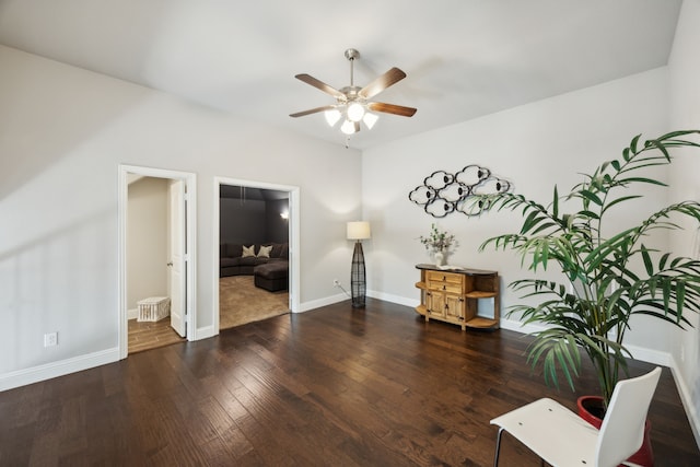 unfurnished room with ceiling fan and dark hardwood / wood-style floors