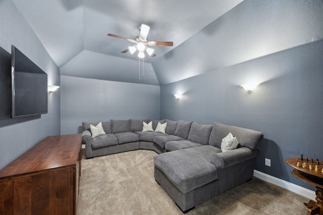 carpeted living room featuring ceiling fan and lofted ceiling