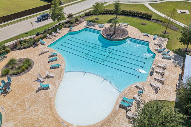 view of pool featuring a lawn and a patio area