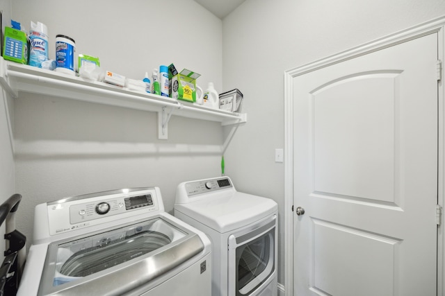 laundry area featuring washing machine and clothes dryer