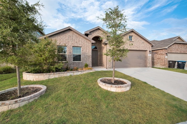 view of front of home featuring a garage and a front lawn