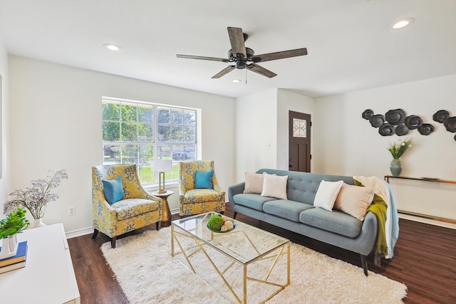 living room with dark hardwood / wood-style floors and ceiling fan