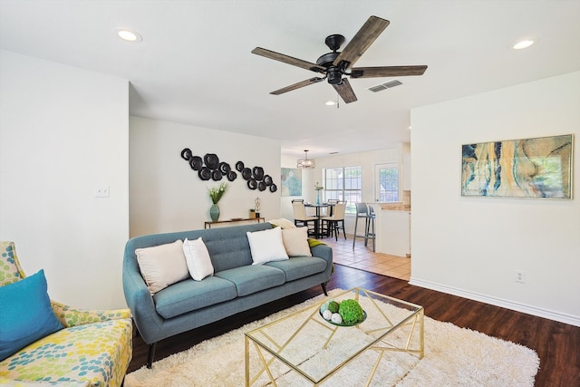 living room with hardwood / wood-style flooring and ceiling fan