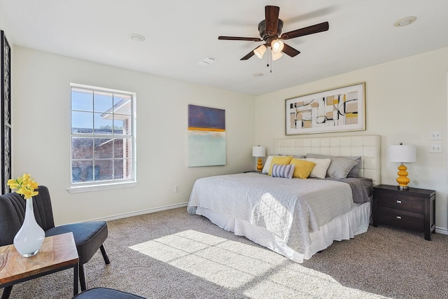 bedroom with ceiling fan and carpet flooring