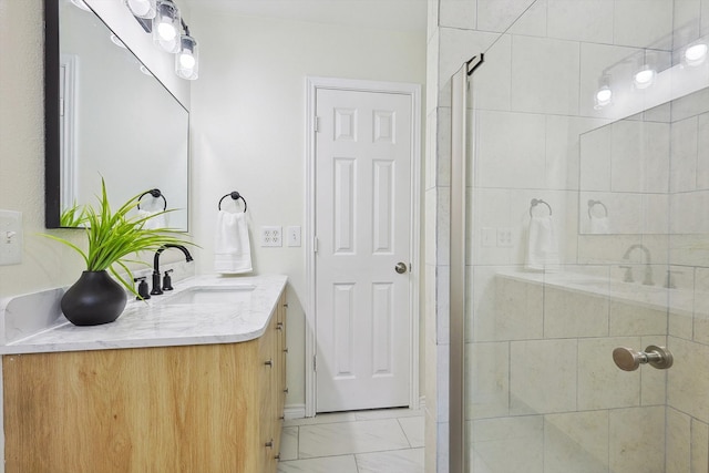 bathroom with an enclosed shower and vanity