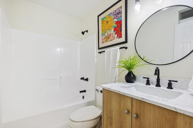 full bathroom with shower / bathing tub combination, vanity, and toilet