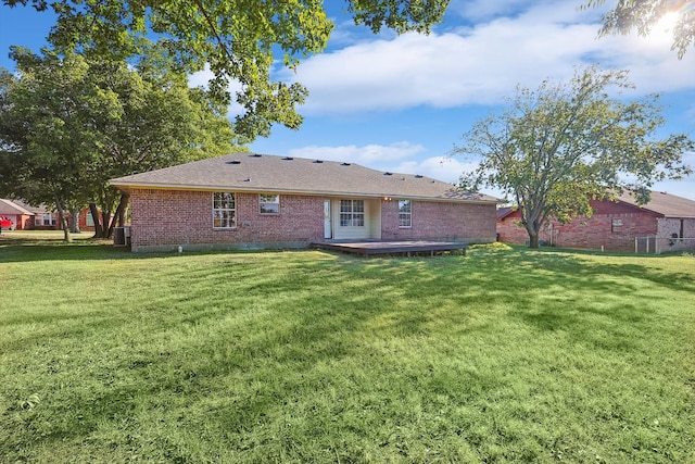 back of house featuring a yard, central AC, and a deck