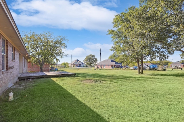 view of yard with a wooden deck