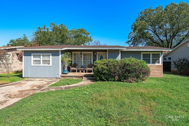 single story home with a front lawn and a porch