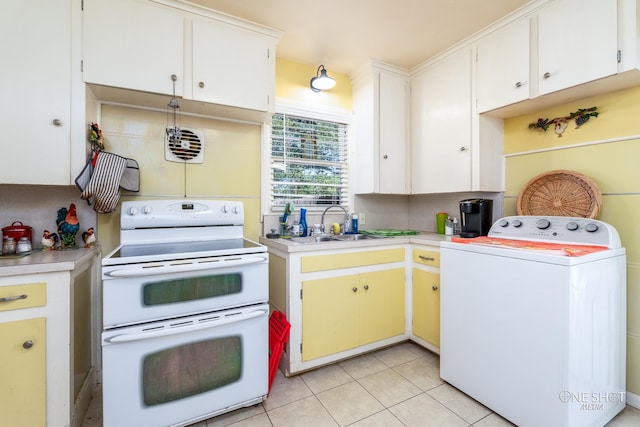 kitchen with white cabinets, washer / dryer, light tile patterned floors, and white electric range