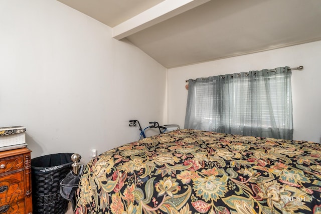 bedroom with lofted ceiling with beams