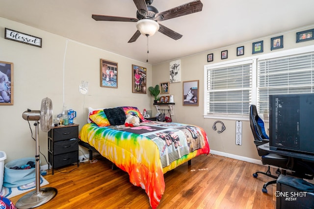 bedroom featuring ceiling fan and hardwood / wood-style floors