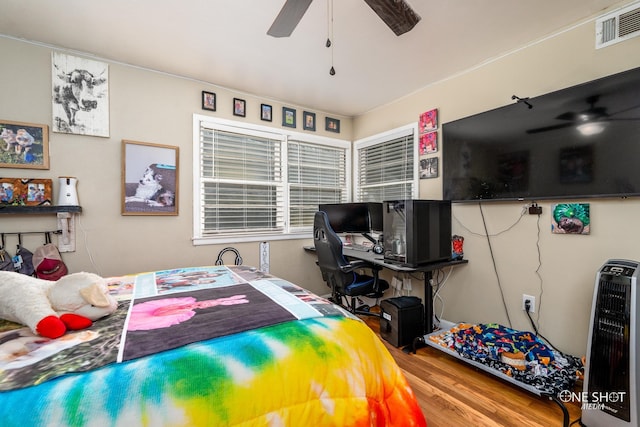 bedroom featuring ceiling fan and hardwood / wood-style floors