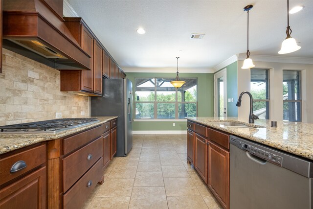 kitchen with premium range hood, a wealth of natural light, stainless steel appliances, and decorative light fixtures