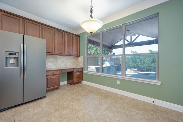 kitchen with tasteful backsplash, light stone countertops, decorative light fixtures, stainless steel refrigerator with ice dispenser, and ornamental molding