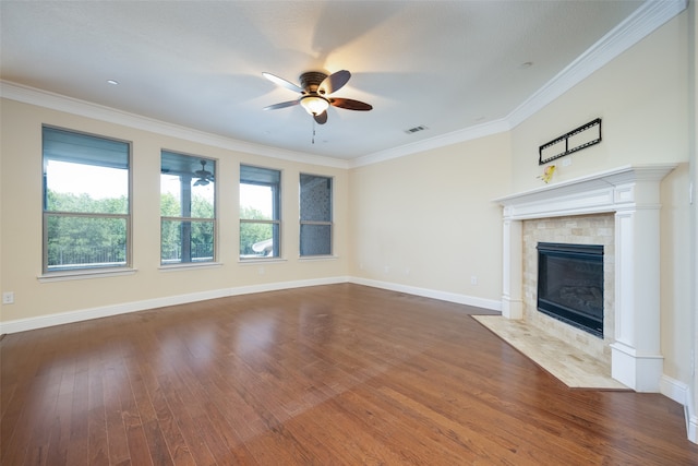 unfurnished living room featuring a fireplace, ornamental molding, dark hardwood / wood-style flooring, and ceiling fan