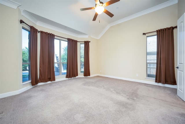 spare room featuring ornamental molding, vaulted ceiling, and light carpet