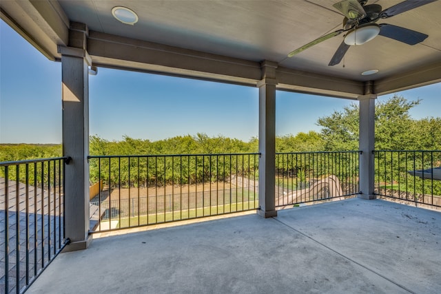 view of patio with a balcony and ceiling fan