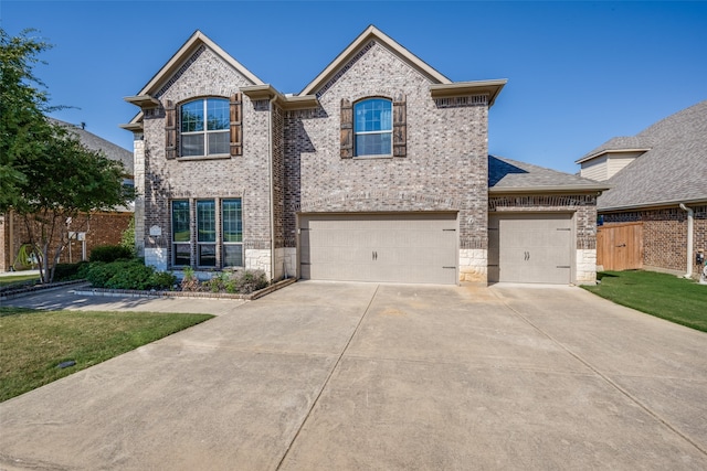 view of front facade featuring a front lawn and a garage